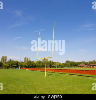 American Football Goalposts on a sunny grass field. Stock Photo