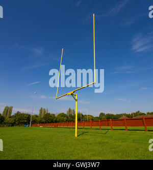 American Football Goalposts on a sunny grass field. Stock Photo