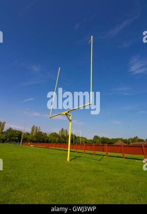 American Football Goalposts on a sunny grass field. Stock Photo