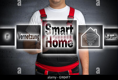 smart home (in german networking future) home touchscreen is operated by craftsman. Stock Photo