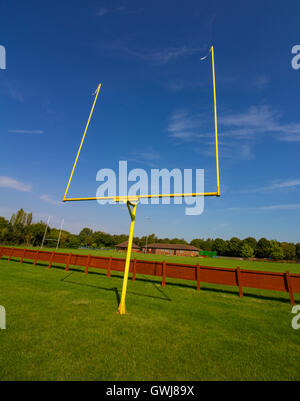 American Football Goalposts on a sunny grass field. Stock Photo