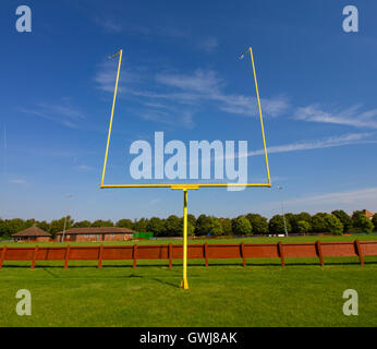 American Football Goalposts on a sunny grass field. Stock Photo