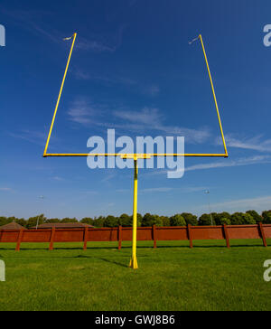 American Football Goalposts on a sunny grass field. Stock Photo