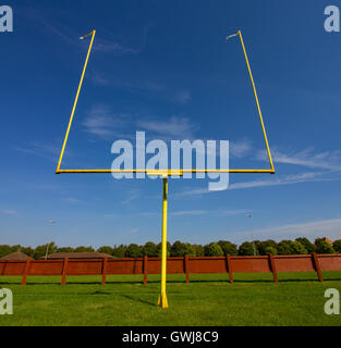 American Football Goalposts on a sunny grass field. Stock Photo