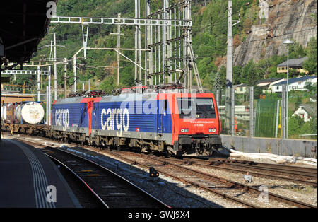 No 474 005 leads a double headed freight train into Brig railway station, Valais, Switzerland Stock Photo