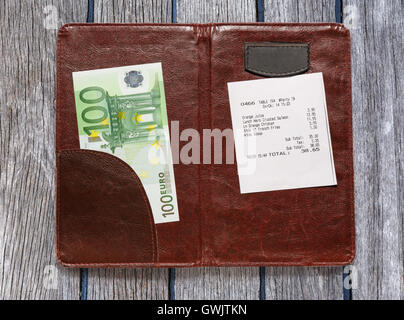 Open check folder with bill and euro banknotes Stock Photo