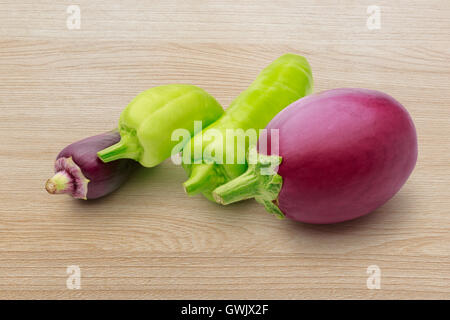 Paprika pepper and fresh eggplant in closeup Stock Photo