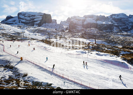 The ski slope and skiers at Passo Groste ski area on December 18, 2015 in Madonna di Campiglio Stock Photo