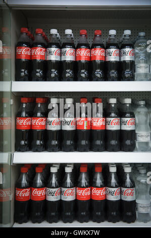 Coke and diet coke bottles on supermarket shelves in UK, which has recently introduced a sugar tax on drinks, which contribute to childhood obesity. Stock Photo