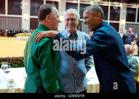 U.S. President Barack Obama talks with New Zealand Prime Minister John Key and Prime Minister of Australia Malcolm Turnbull during the ASEAN gala dinner at the National Convention Centre September 2016 in Vientiane, Laos. Stock Photo