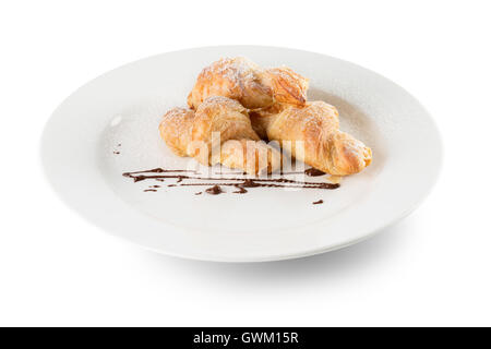 croissants on white plate isolated on the white background. Stock Photo