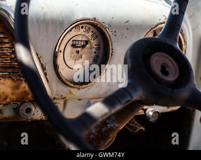 Speedometer and dashboard of an old wreck car left in Solitaire on the Namib desert. Stock Photo