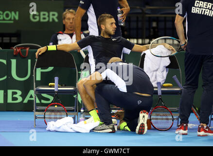 Dan Evans receives treatment during his match against Jan-Lennard ...