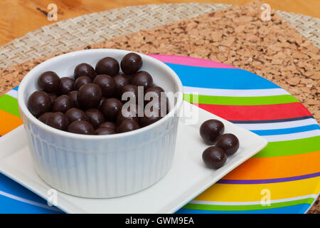 Chocolate covered espresso coffee beans in a cup Stock Photo