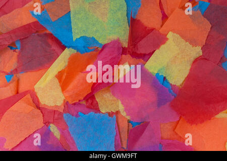 Colored tissue paper torn in different sized pieces Stock Photo