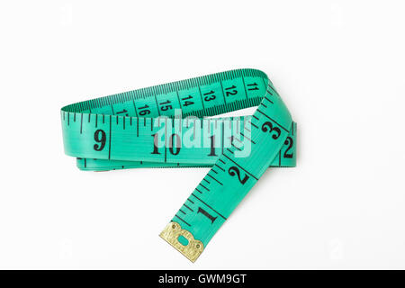 A green tape measure folded Stock Photo