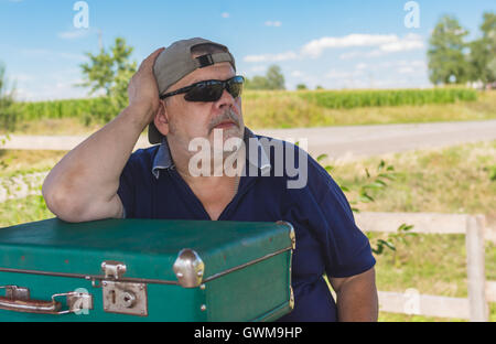 Outdoor portrait of elderly Caucasian man in black sunglasses Stock Photo
