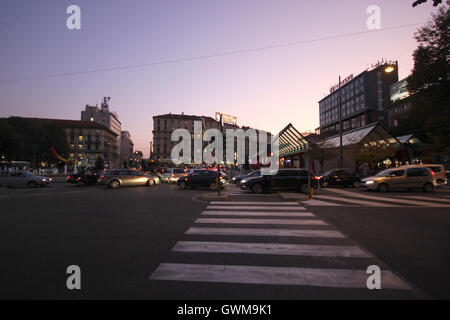 zebra crossing and traffic in Cadorna Station by night, Milan, Italy Stock Photo