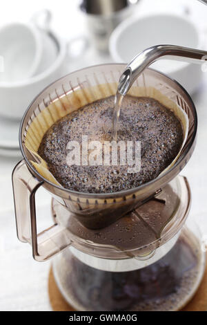 making hand drip coffee by paper filter Stock Photo