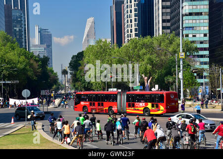 Metrobus crossing the Avenida Paseo de la Reforma. The Avenue is closed on Sunday mornings for bike riders. Mexico City, CDMX, Mexico Stock Photo