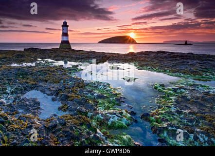 Sunrise at Trwyn Du Lighthouse, Penmon Point, Isle of Anglesey, North Wales, UK Stock Photo