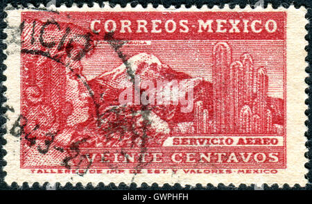 Postage stamp printed in Mexico, shows the Aztec Eagle Man, Eagle, a giant cactus Saguaro and the volcano Popocatepetl Stock Photo