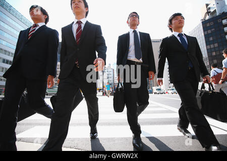 Young Japanese businessmen walking Stock Photo