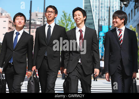 Young Japanese businessmen walking Stock Photo