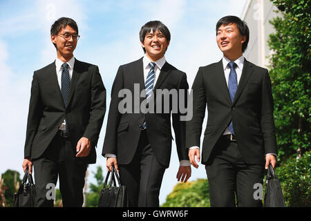 Young Japanese businessmen walking Stock Photo