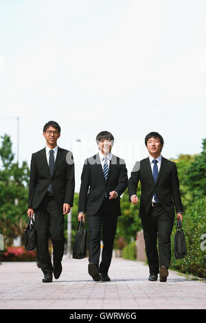 Young Japanese businessmen walking Stock Photo