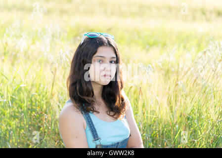 Portrait of sad teen girl on nature Stock Photo