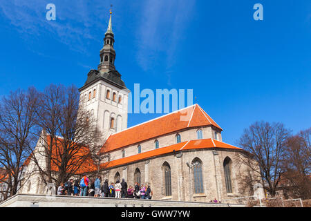 Tallinn, Estonia - May 2, 2016: Group of tourists near Niguliste or St. Nicholas Church in old Tallinn Stock Photo