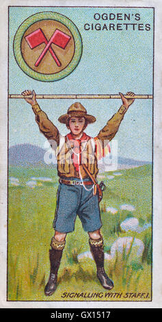 Ogden's cigarette card of a boy scout signalling with a staff Stock Photo