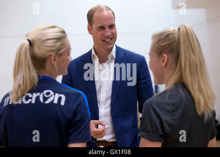 The Duke of Cambridge meets members of the football team during a visit to Caius House youth centre, London. Stock Photo