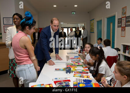 The Duke of Cambridge meets young people attending a painting class during a visit to Caius House youth centre, London. Stock Photo
