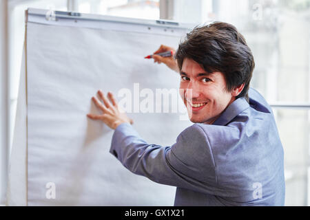 Student as businessman at presentation from ideas on whiteboard Stock Photo