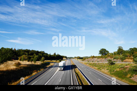 trucks driving on freeway, wide view Stock Photo