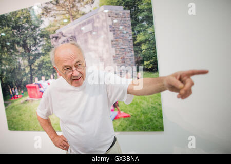 Duesseldorf, Germany. 14th Sep, 2016. Photographer Horst Wackerbarth speaking at the NRW Forum in Duesseldorf, Germany, 14 September 2016. For more than 30 years, Wackerbarth has been photographing people all over the world sitting on his red couch. Now, he brings the legendary furniture back to his actual home. The retrospective 'Heimat.NRW' can be seen between 17 September and 30 October 2016. PHOTO: ROLF VENNENBERND/dpa/Alamy Live News Stock Photo