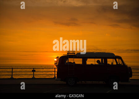 Aberystwyth Wales UK, Thursday 15 September 2016  UK weather: The classic iconic shape of a Volkswagen T2 camper van in silhouette against a dramatic sunset sky in Aberystwyth on the west Wales coast   photo Credit:  Keith Morris / Alamy Live News Stock Photo