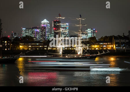 London, UK. 15th September, 2016. A river taxi or clipper passes with Canary Wharf seen in the background during Royal Greenwich Tall Ships Festival Credit:  Guy Corbishley/Alamy Live News Stock Photo