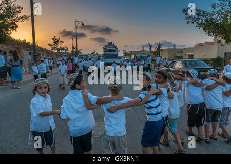Neria, Israel. 15th September, 2016. Neria, Israel/West Bank. A parade celebrating the inauguration of a Torah scroll (Bible), containing the Pentatuch, Judaism holliest text, Dedicated to the memory of Neria residents Eitam and Naama Henkin, Murdered by Palestinian Terrorists on October 2015 Credit:  Yagil Henkin/Alamy Live News Stock Photo