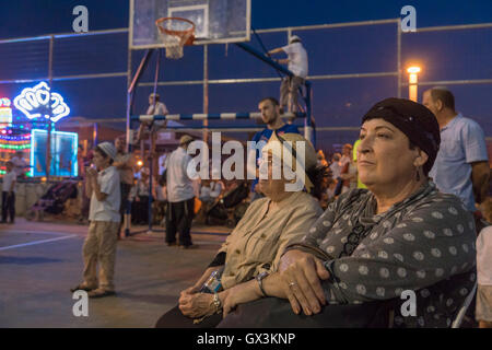 Neria, Israel. 15th September, 2016. Neria, Israel/West Bank. Hila Armoni (R) and Chana Henkin, mothers of Neria residents Eitam and Naama Henkin who were  Murdered by Palestinian Terrorists on October 2015,  during a ceremony of Inauguration of a Torah scroll. Credit:  Yagil Henkin/Alamy Live News Stock Photo