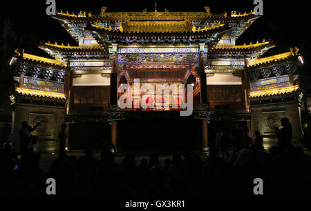 Beijing, China. 15th Sep, 2016. Visitors watch a comedy show in Gubei Water Town in Beijing, capital of China, Sept. 15, 2016. Tourists celebrated the Mid-Autumn Festival by visiting the Gubei Water Town on Thursday. Credit:  Hou Jun/Xinhua/Alamy Live News Stock Photo
