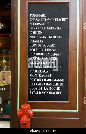 Blackboard with variety of fine Burgundy wines listed on sale at entrance Jean-Luc Aegerter wine shop, Beaune, Côte d'Or, France Stock Photo