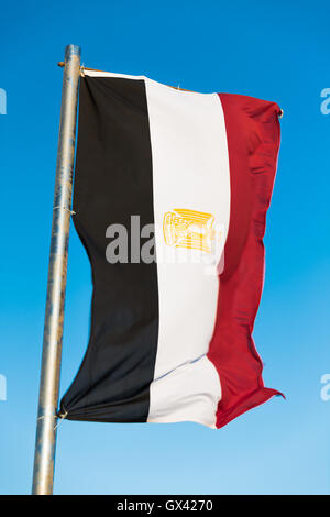 Egyptian flag on flagpole Stock Photo