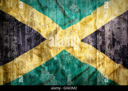 Grunge style of Jamaica flag on a brick wall for background Stock Photo