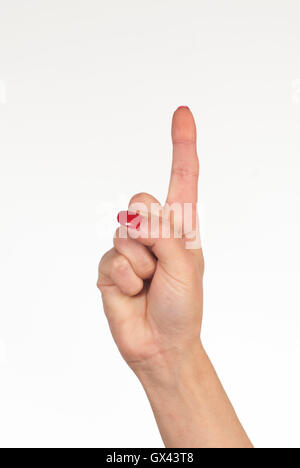 Woman's hand showing index finger counting one Stock Photo