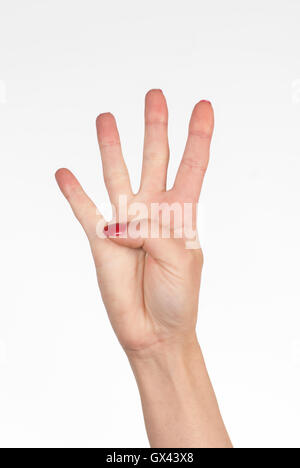 Woman's hand counting four Stock Photo
