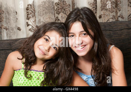 Happy sisters smiling Stock Photo