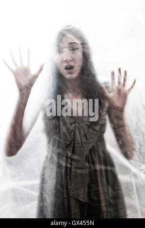 Scared woman trapped Stock Photo